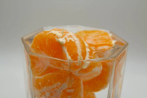 Peeled Tangerine Slices Glass Water — Stockfoto