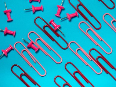 Office work. Colored paper clips. Colored paper with staples. Work with documents.  Colorful office supplies.