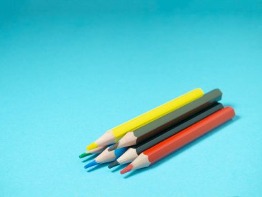 School supplies.   Multicolored pencils.  The process of preparing for work. Creative mes