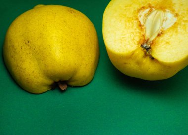 Sliced quince.Juicy fruit on a yellow background. Ripe useful product.Weathered fruit pulp. Nutrition on a diet.