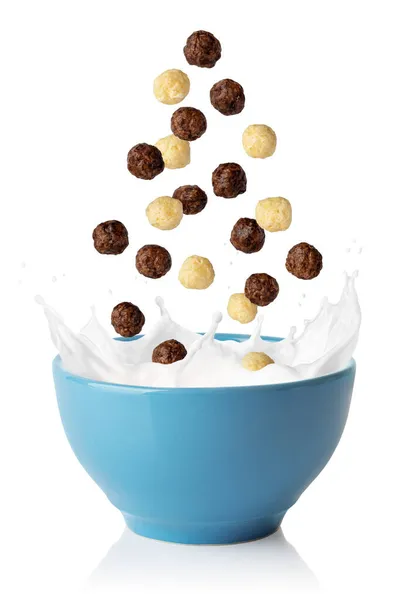 Boules de maïs vanille et chocolat tombant dans un bol bleu — Photo