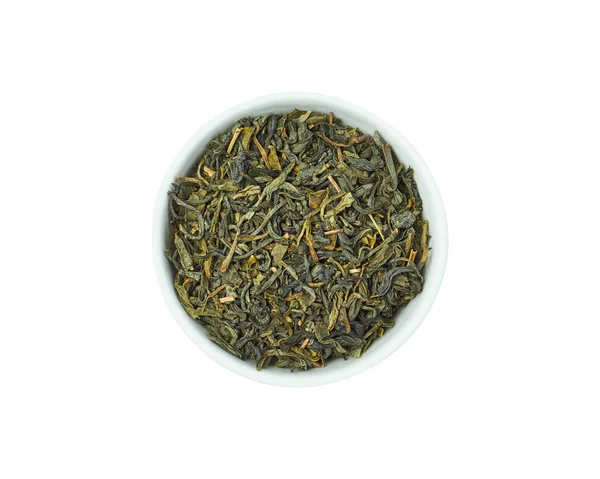 Tè verde secco in ciotola bianca isolato su sfondo bianco. Bevanda sana. — Foto Stock