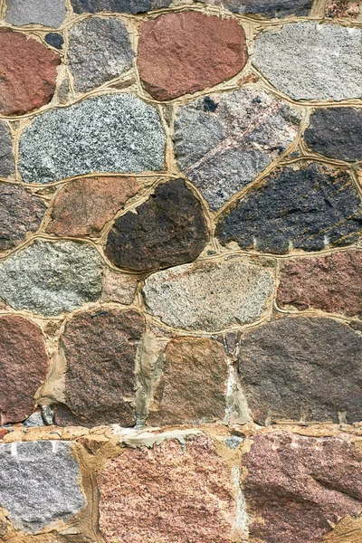 Fragmento de un viejo muro de piedra. Fondo de roca antigua —  Fotos de Stock
