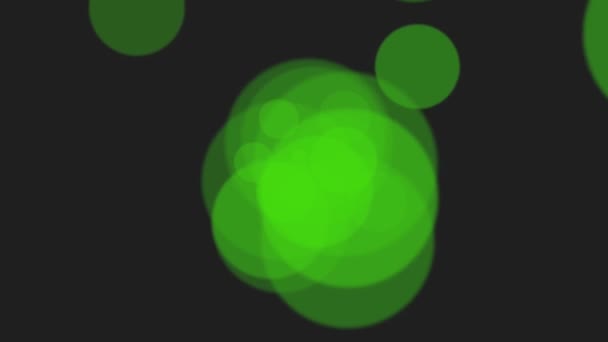 Zelené částice a kulaté bokeh na lesklém pozadí
