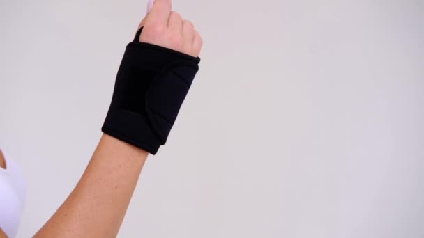 Black Wrist Thumb Brace Stabilizer Woman Hand — стокове відео