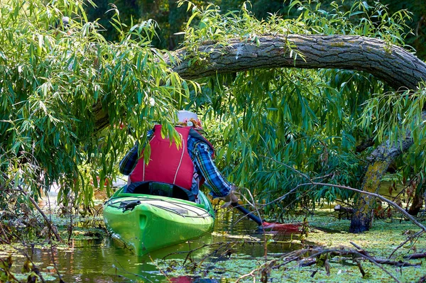 Woman Green Kayak Rowing Fallen Tree River — Foto de Stock