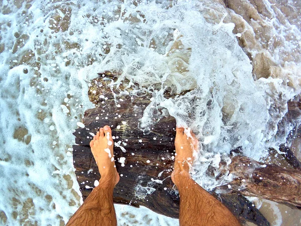 Legs Man Standing Snag Lying Sandy Seashore Waves Foam — Foto de Stock