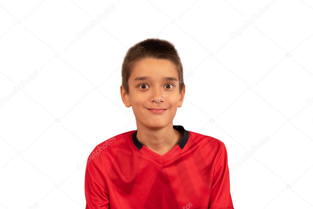 urprised handsome boy in a red shirt on a white background