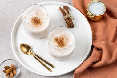 Homemade vegan Eggnog in glasses for Christmas. Alternative dairy-free drink. clipart