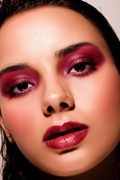 Beauty portrait of a young brunette with creative make-up — Stock Photo, Image