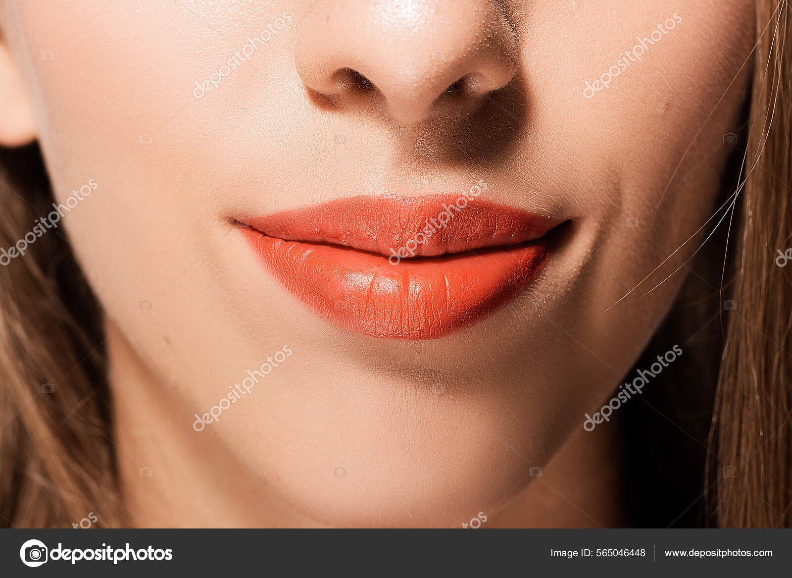 Lips Of A Girl Painted With Lipstick Close-Up Стоковое Фото.