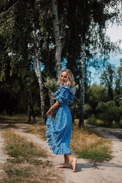 Woman Long Blue Dress Whirls Has Fun — Stockfoto