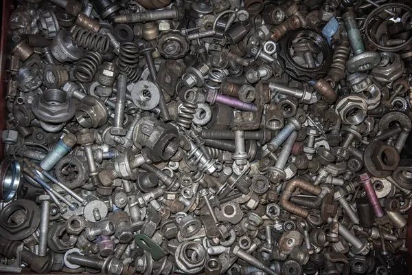 stock image Box of random nuts and bolt, parts, washers, screws in workshop garage.