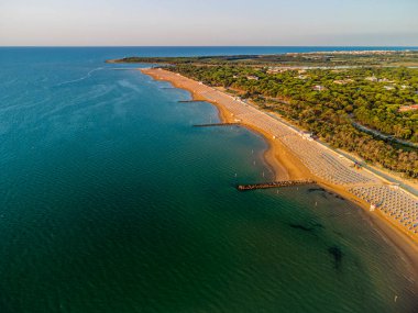 Aerial view of the coastline and the beach of Lignano Sabbiadoro, Italy.