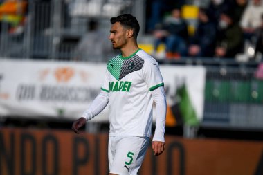 Sassuolo 'nun Kaan Ayhan portresi İtalyan futbolu Serie A maçı sırasında Venezia FC ile ABD Sassuolo arasında Venedik, İtalya' daki Pier Luigi Penzo Stadyumu 'nda oynandı.