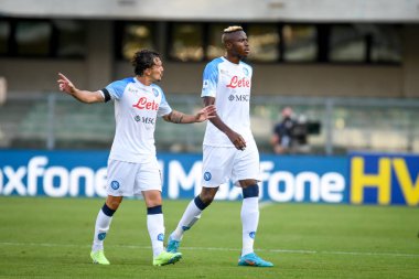 Napoli's Mario Rui with Napoli's Victor Osimhen portrait  during  italian soccer Serie A match Hellas Verona FC vs SSC Napoli at the Marcantonio Bentegodi stadium in Verona, Italy, August 15, 2022 - Credit: Ettore Griffon