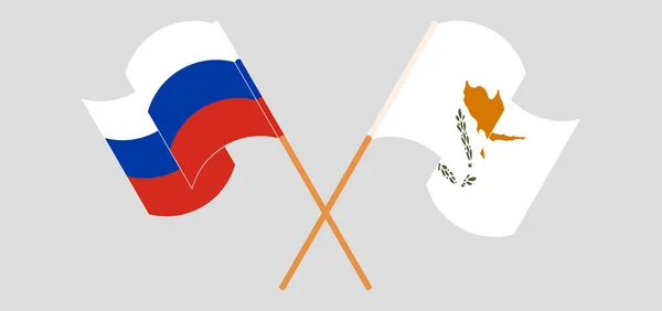 Overgestoken en wapperende vlaggen van Cyprus en Rusland — Stockvector