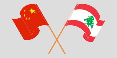 Crossed and waving flags of Lebanon and China