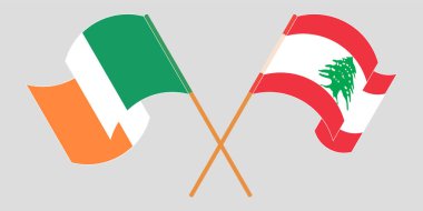 Crossed and waving flags of Lebanon and Ireland