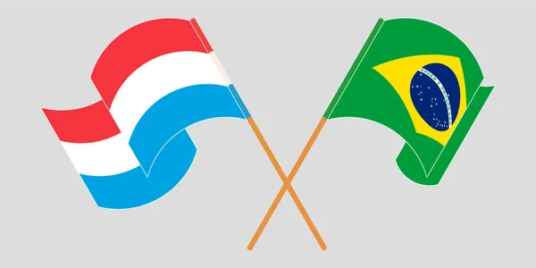 Drapeaux croisés et agités du Luxembourg et du Brésil — Image vectorielle