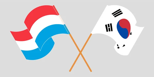 Bandeiras cruzadas e onduladas do Luxemburgo e da Coreia do Sul — Vetor de Stock