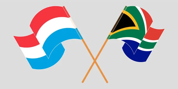 Banderas cruzadas y ondeantes de Luxemburgo y la República de Sudáfrica — Archivo Imágenes Vectoriales