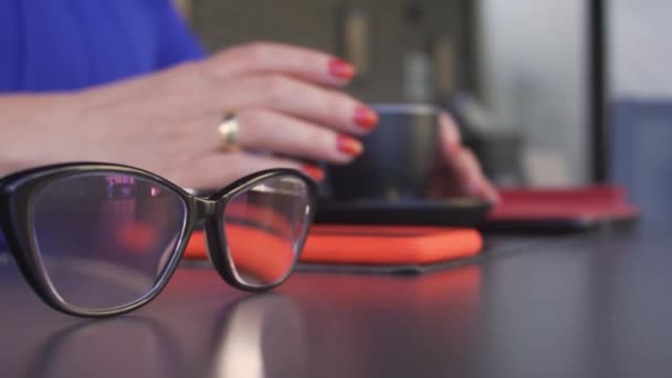 Woman Cafe Drinks Coffee Phone Glasses Table Close Female Hands — Stock Video