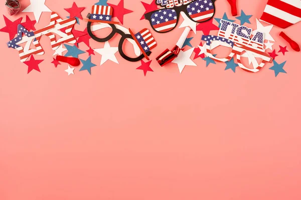 USA independence day party elements top view flat lay on pink