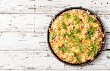 fresh homemade hawaiian pizza on white rustic table background