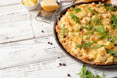 fresh homemade hawaiian pizza on white rustic table background