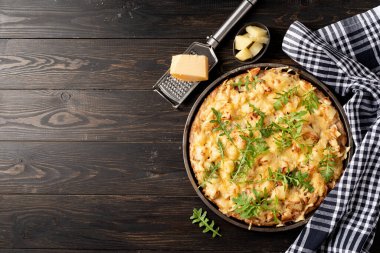 fresh homemade hawaiian pizza on black rustic table background