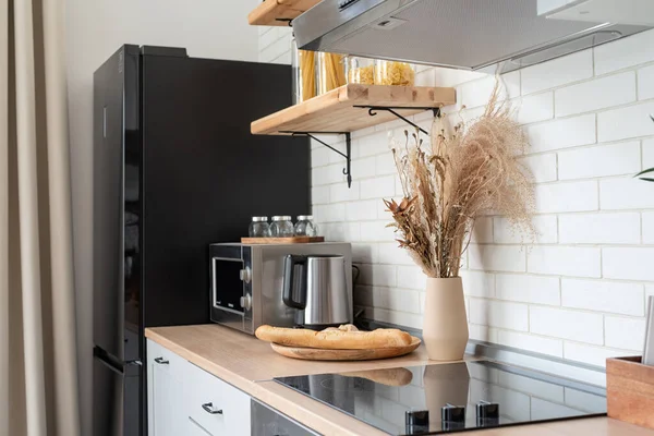 Interior of kitchen in rustic style with vintage kitchen ware and wooden wall