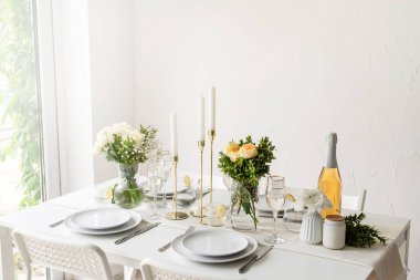Wedding table set up in taditional style with roses grass and greenery. Wedding table scapes