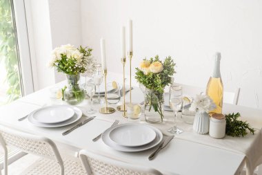 Wedding table set up in taditional style with roses grass and greenery. Wedding table scapes