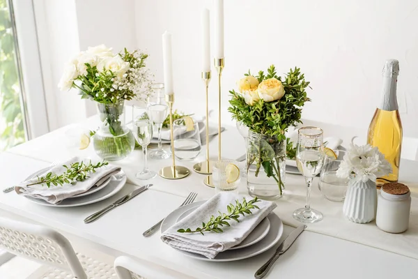 Wedding table set up in taditional style with roses grass and greenery. Wedding table scapes