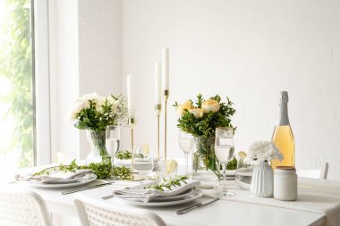 Wedding table set up in taditional style with roses grass and greenery. Wedding table scapes