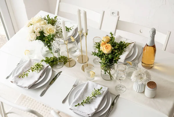 Wedding table set up in taditional style with roses grass and greenery. Wedding table scapes