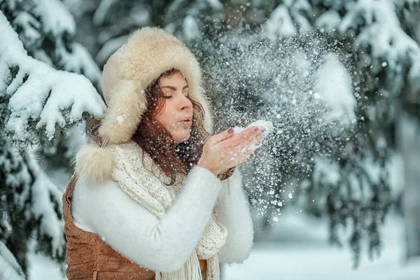 Women Sweater Hat Winter Blowing Snow Her Hands Snowy Forest — Stock Photo, Image
