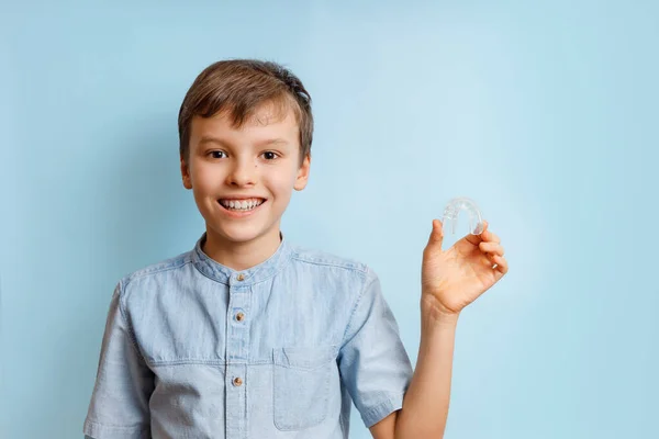 Portrait of the boy of orthodontic silicone trainer. — Stock Photo, Image