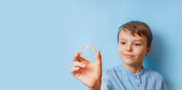Portrait of the boy of orthodontic silicone trainer. — Stock Photo, Image