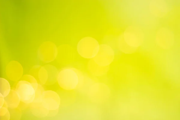 Abstract Blurred Background. Defocused Lights on Yellow-Green Background