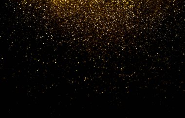 Defocused Glittery Golden Lights over Dark Background