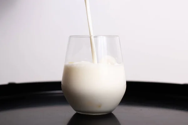 Pouring Milk Glass — Stock Photo, Image