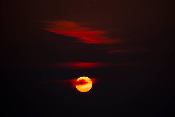 Romantic, blood red sunset with clouds