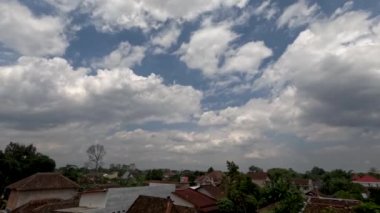 Time lapse of cloud movement over residential areas in rural areas, climate change concept