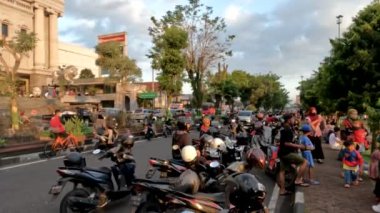 Yogyakarta, Indonesia - August 17, 2022. The use of the road as a parking area on the Jalan Jogja-Magelang section, lack of parking spaces in areas that are the centre of community activity