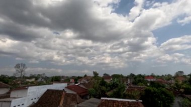 Time lapse of cloud movement over residential areas in rural areas, climate change concept