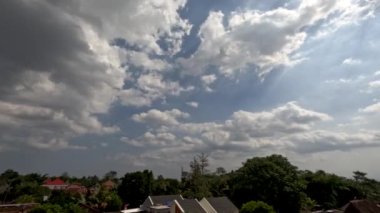 Time lapse of cloud movement over residential areas in rural areas, climate change concept