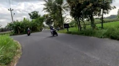 Yogyakarta, Indonesia - August 25, 2022. Traffic situation on Jalan Kebonagung Sleman, a small road supporting the new Yogyakarta-Bawen toll road section
