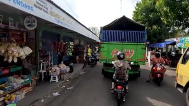 Sleman, Indonesia - August 30, 2022. The situation on the ring road of the Sleman Traditional Market, which is used as a parking lot, will be very congested and crowded at peak times